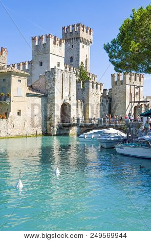 Sirmione, Italy - August 10, 2008: Garda Lake, The Rocca Scaligera Castle (xiii Century)