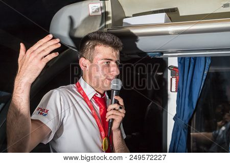 Marmaris, Turkey - May 19, 2018: Male Tour Guide With A Microphone In The Bus In Evening Time