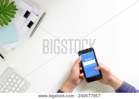Chiang Mai,thailand - June 26, 2018 : A Man Hand Holding Facebook Showing On Huawei P10 , The Login 