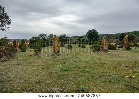 Circle Of Stones In The Middle Of The Bush Against Cloudy Sky