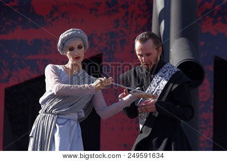 ST. PETERSBURG, RUSSIA - JULY 15, 2018: Dmitry Kondratiev as Macbeth (right) in the opera Macbeth outdoors during the festival All Together Opera. It was 2nd of 4 performances