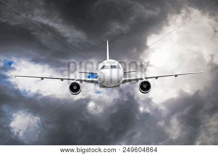 Passenger Airplane Flies Through The Turbulence Zone Through The Lightning Of Storm Clouds In Bad We