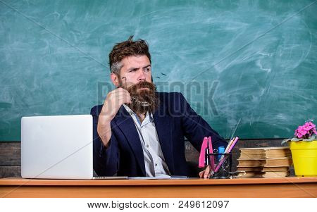 Teacher Concentrated Bearded Mature Schoolmaster Listening With Attention. Teacher Formal Wear Sit T