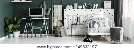 Bedroom Interior With Mockup Computer, Decor, White Metal Bed And Fresh Plants On The Floor