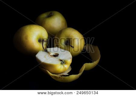 Bowl Of Yellow Apples. On Black Background.