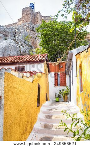 Scenic Narrow Street With Old Houses In Anafiotika, Plaka District, Athens, Greece. Plaka Is One Of 