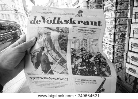 Paris, France - Jul 16, 2018: Man Buying De Volkskrant Dutch Newspaper Announcing France Champion Ti