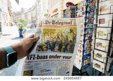 Paris, France - Jul 16, 2018: Man Buying De Telegraaf Newspaper Announcing France Champion Title Aft