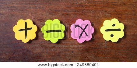 Sticky Colorful Notes In Flower Shape, Isolated, With Math Symbols On Wooden Background.