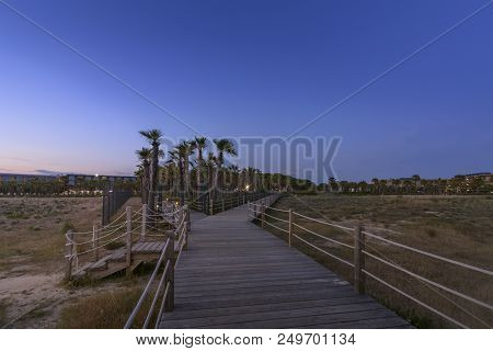 Dusk View In Walkway To Salgados Beach In Albufeira, Algarve Tourism Destination Region, Portugal.