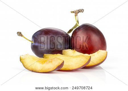 Group Of Two Whole Three Slices Of Fresh Violet-blue Plum Vibrant Moyer Variety Set Isolated On Whit