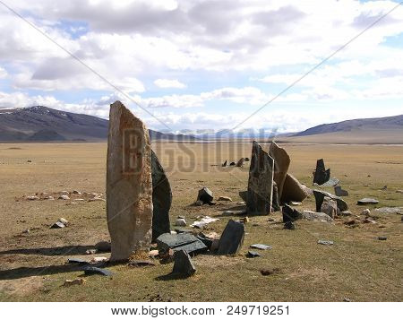 Ancient Gravestones In The Steppes Of The Mongolia. Mongolian Cemetery