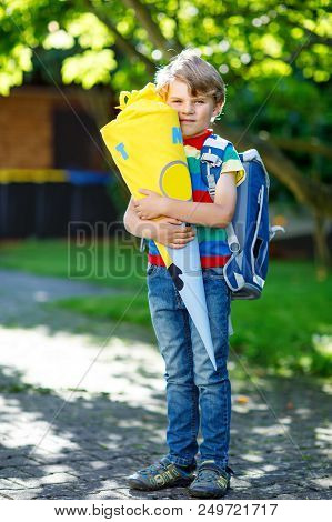 Happy Little Kid Boy In Colorful Shirt And Backpack Or Satchel And Traditional German School Bag Con