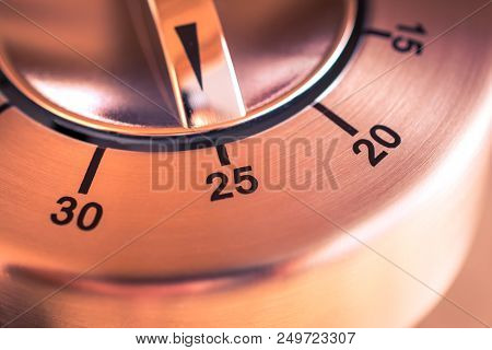 25 Minutes - A Macro Of An Analog Chrome Kitchen Timer