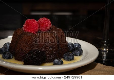 Molten Lava Cake With Berries And Syrup