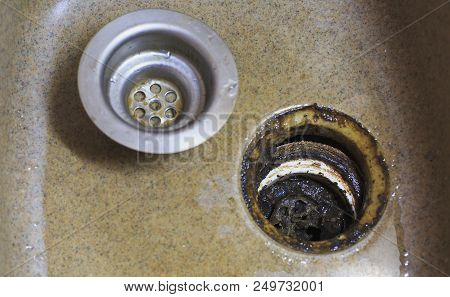Clogged Kitchen Sink In The Kitchen. Cleaning A Clogged, Dirty Washbasin