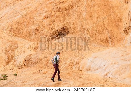 Mtiuleti, Georgia - May 21, 2016: Tourist Walking Near Roadside Springs. Red Mineral Water.