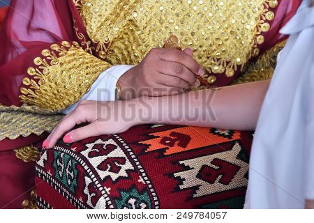 A Henna Or Mehndi Applier Woman From Qatar At Work. Process Of Applying Traditional Mehndi Henna On 