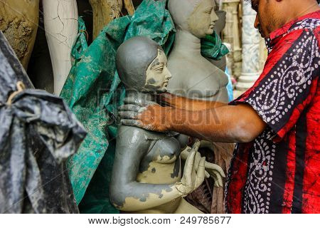 Kumartuli,west Bengal, India, July 2018.an Clay Scuplture Artist Working On A Clay Idol Of Goddess D