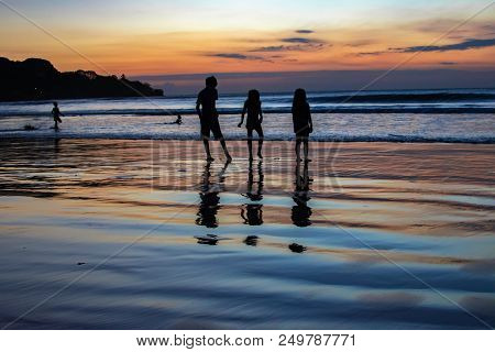 Children Plays On Sunset In Asia, Bali, Indian Ocean