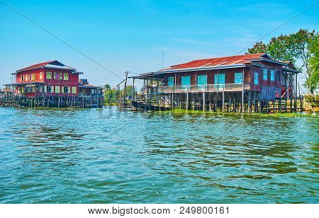 Inle Lake Is Popular For Its Stilt Villages With Traditional Colored Wooden Houses And Fast Kayaks, 