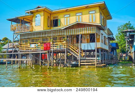 The Scenic Colorful  Wooden Two-story House On Stilts On Inle Lake, Inpawkhon, Myanmar.