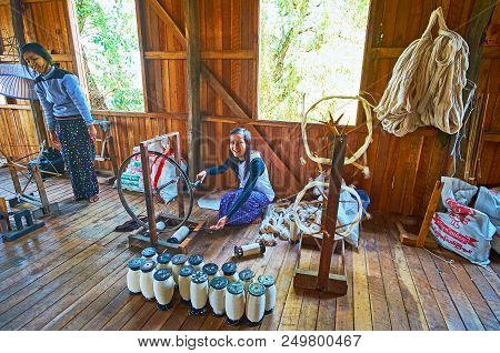 Inpawkhon, Myanmar - February 18, 2018: The Young Worker Of Hand Weaving Workshop Demonstrates Tradi