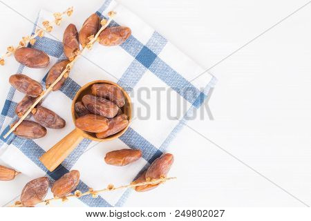 Dates Fruit In Wooden Ladle On White Background,dried Date Palm Fruits Top View