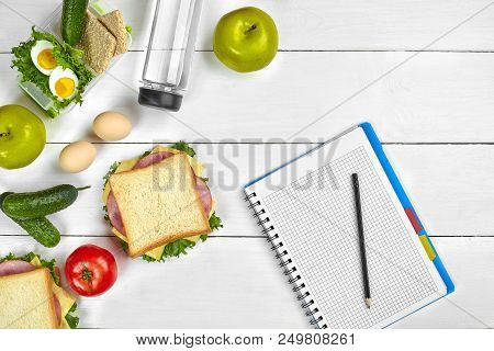Top View Planning Notebook With Copy Space And Healthy Breakfast. Sandwich With Ham And Cheese, Eggs