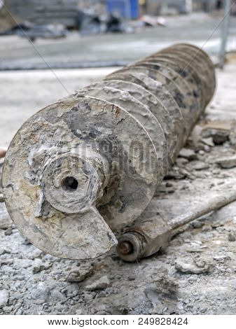 Closeup of dirty vertical drilling rig auger
