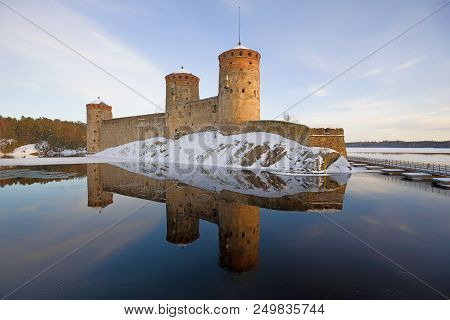 View Of Olavinlinn Fortress In The Quiet March Evening. Savonlinna, Finland