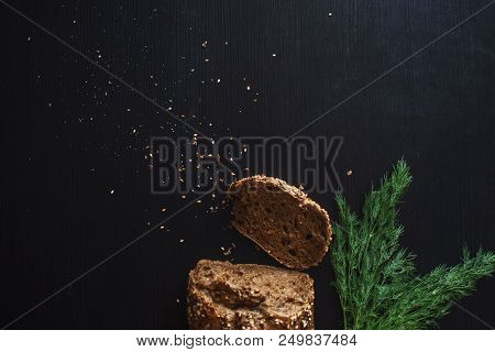 Loaf Of Multi-grain Bread, Cut Into Sandwiches. Close-up, Free Space For Text. Black Background