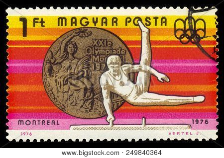 Hungary - Circa 1976 : A Stamp Printed In Hungary Shows Gymnast On The Pommel Horse And Olympic Gold