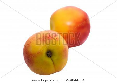 Closeup Of Two Nectarines On White Isolated Background