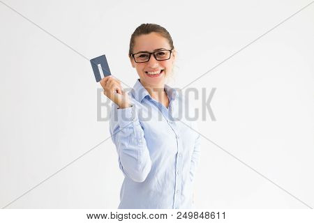 Positive Female Cardholder Happy To Receive Cash Back. Young Caucasian Woman In Formal Shirt Raising
