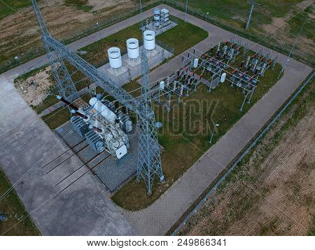 High Voltage Energy Transformer Station In Forest, Aerial View.
