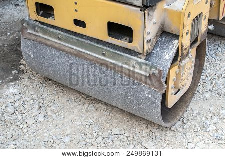 Detail Of Small Road Roller Working At Road Construction Compacting The Gravel Foundation For City S