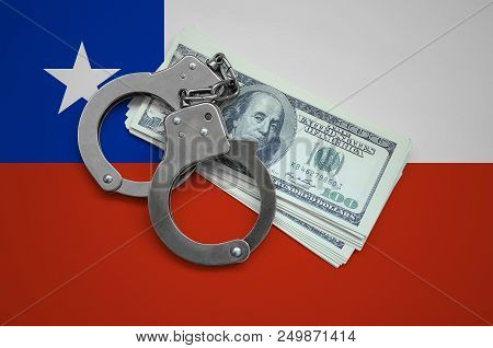 Chile Flag  With Handcuffs And A Bundle Of Dollars. Currency Corruption In The Country. Financial Cr