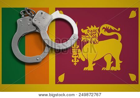 Sri Lanka Flag  And Police Handcuffs. The Concept Of Crime And Offenses In The Country.
