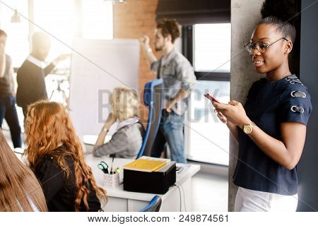 Close Up Side View Shot Of Africanamerican Secretary Surfing The Net While Training
