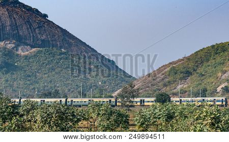 December 08,2016. Ranch,jharkhand, India.an Indian Passenger Train Is Passing By The Range Of Mounta