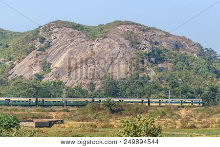 December 08,2016. Ranch,jharkhand, India.an Indian Passenger Train Is Passing By The Range Of Mounta