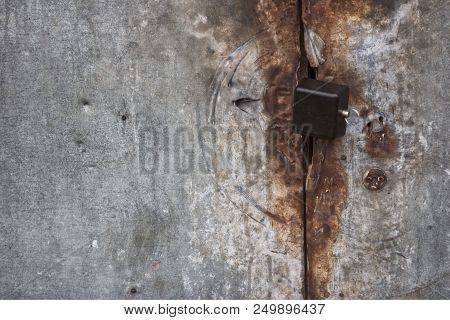 Photo Of Rust Locked Metal Doors And Keylock