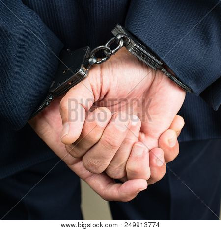 Close-up Businessman Hands In Handcuffs. Businessman Bribetaker Or Briber. Concept Of Fraud, Detenti