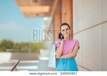 Fashion Girl With Shopping Bags In Front Of The Mall
