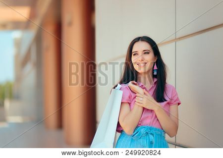 Fashion Girl With Shopping Bags In Front Of The Mall