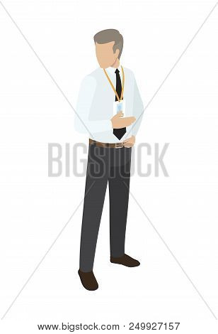 Man In Business Suit With Name Badge On Neck Points With One Hand To Side, Other Arm Lies On Brown B