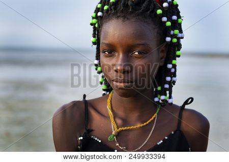 Orango Island, Guinea-bissau - February 2, 2018:  Portrait Of A Beautiful Young Girl At The Beach In