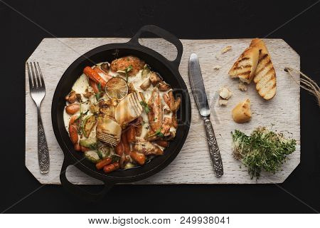 Slow Cooked Meat Casserole On Wooden Board, Top View. Healthy Restaurant Stew