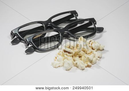 Pair Of 3d Glasses And Salty Popcorn On White